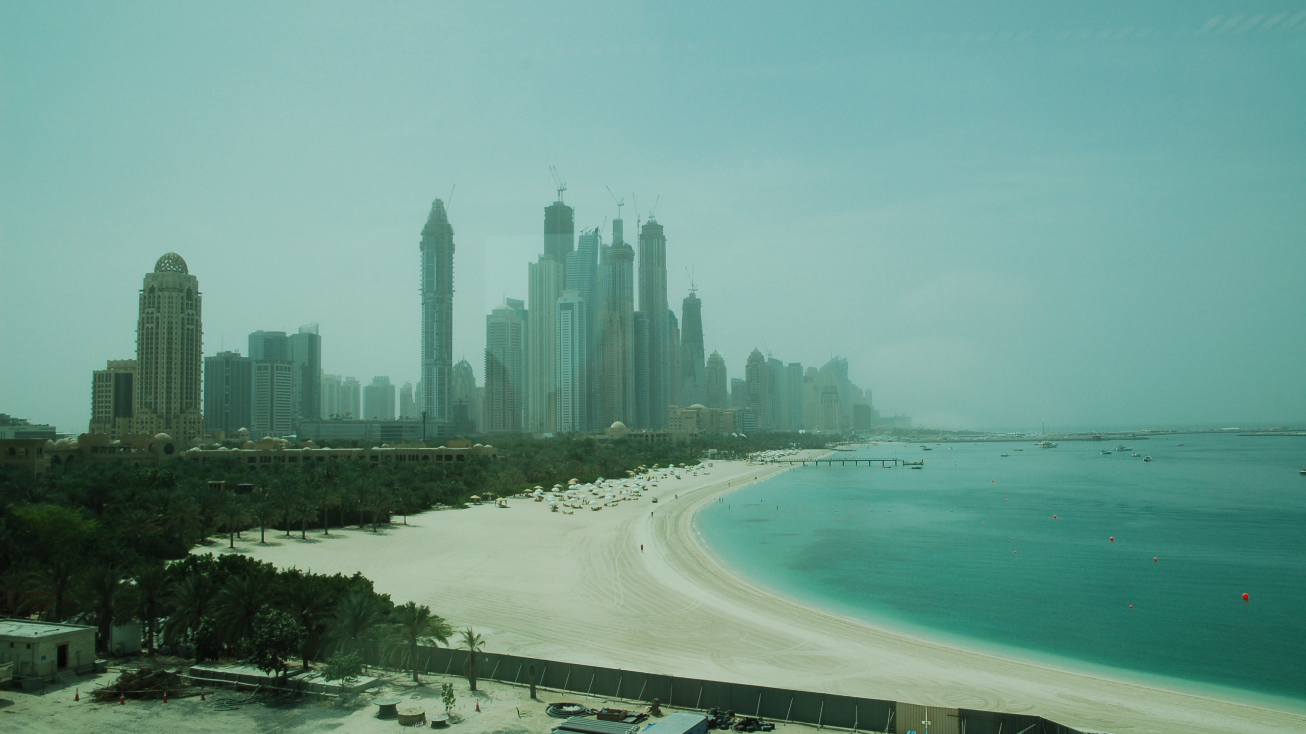 High Rise Buildings Near Sea During Daytime. Wallpaper in 2560x1440 Resolution