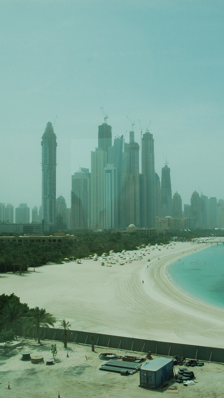 High Rise Buildings Near Sea During Daytime. Wallpaper in 750x1334 Resolution