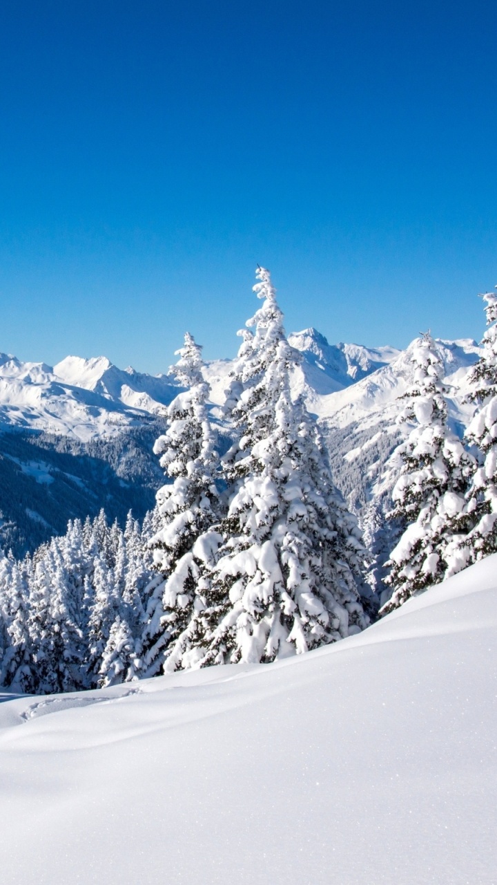 Snow Covered Mountain Under Blue Sky During Daytime. Wallpaper in 720x1280 Resolution