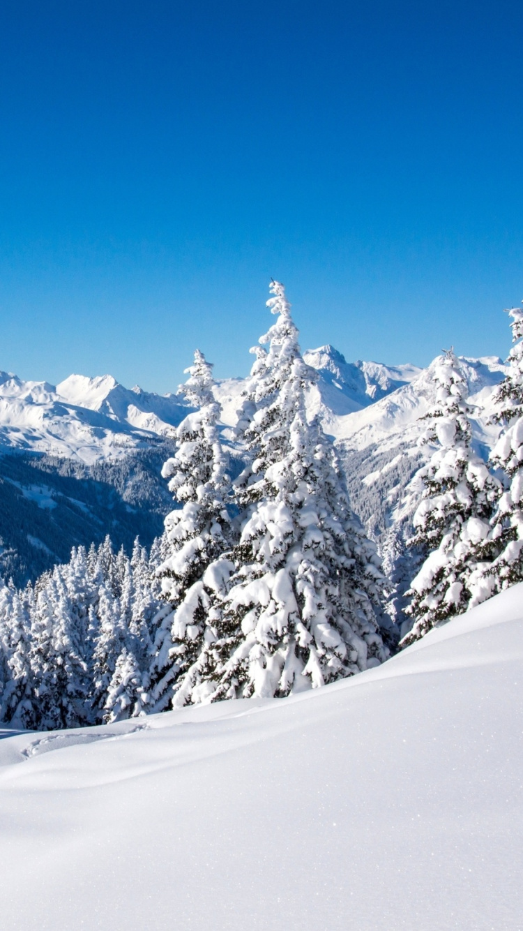 Snow Covered Mountain Under Blue Sky During Daytime. Wallpaper in 750x1334 Resolution