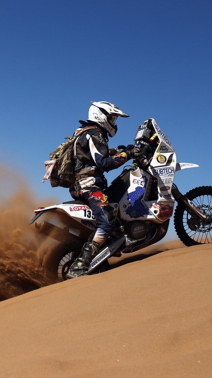 Man Riding Motorcycle on Desert During Daytime. Wallpaper in 720x1280 Resolution