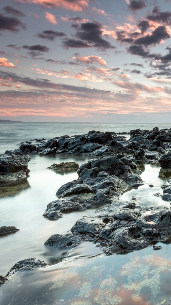Rocky Shore Under Cloudy Sky During Daytime. Wallpaper in 720x1280 Resolution