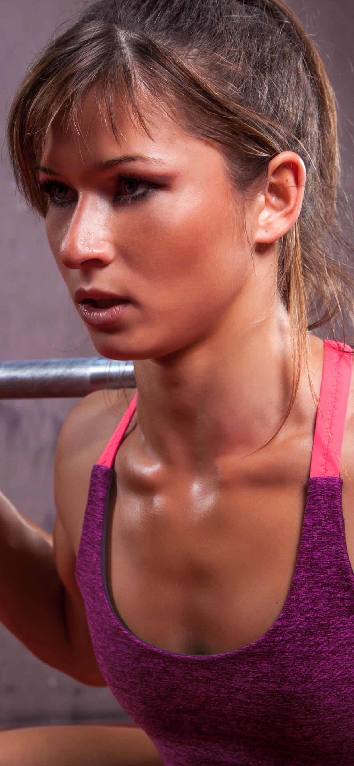 Woman in Pink Tank Top Holding Barbell. Wallpaper in 1242x2688 Resolution