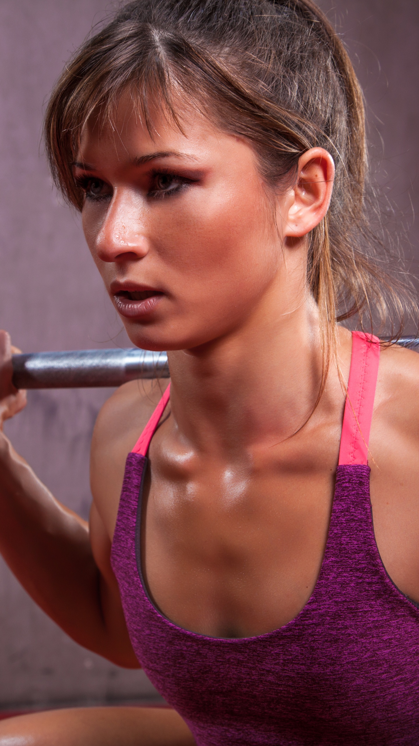 Woman in Pink Tank Top Holding Barbell. Wallpaper in 1440x2560 Resolution