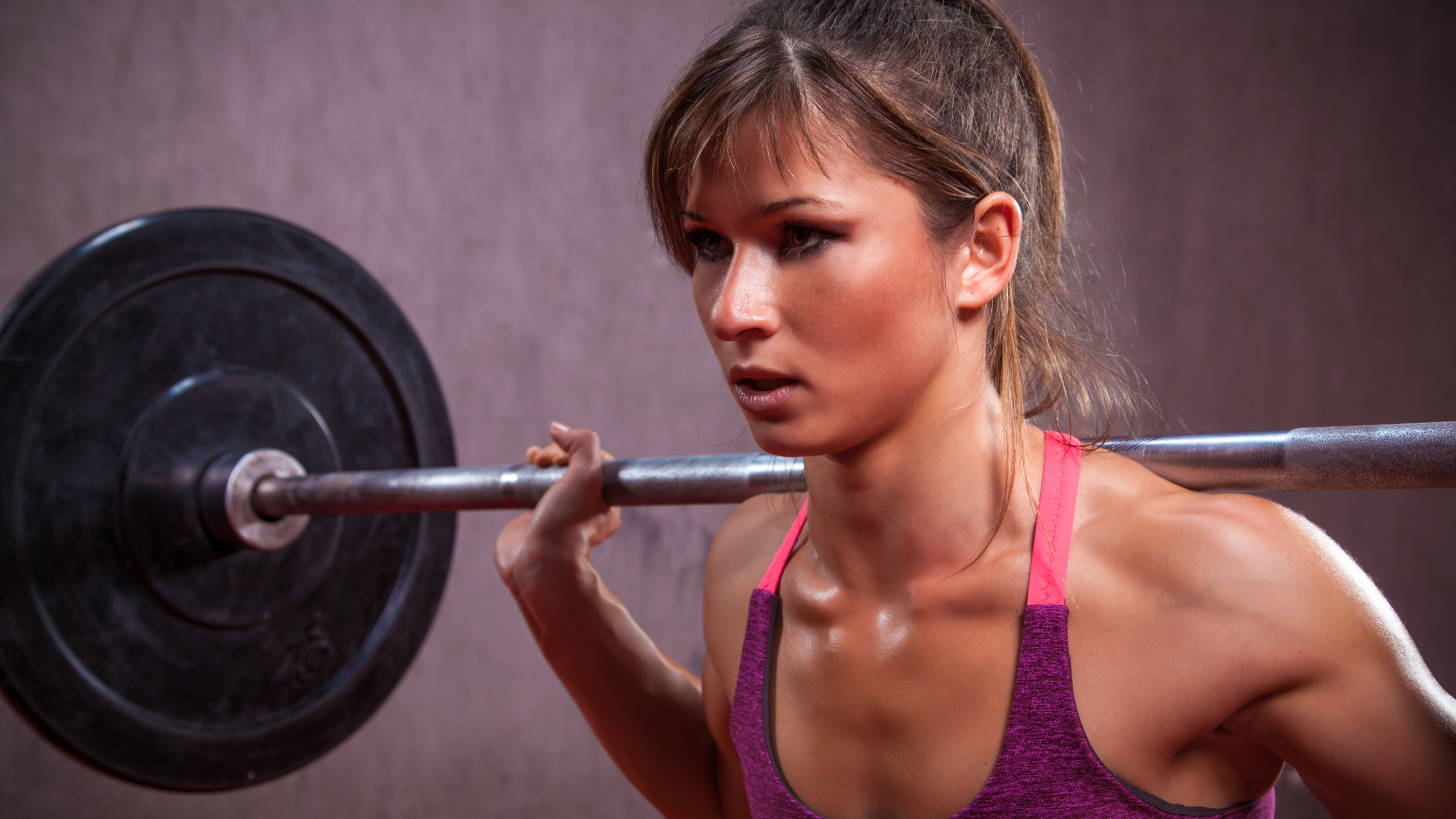 Woman in Pink Tank Top Holding Barbell. Wallpaper in 2560x1440 Resolution