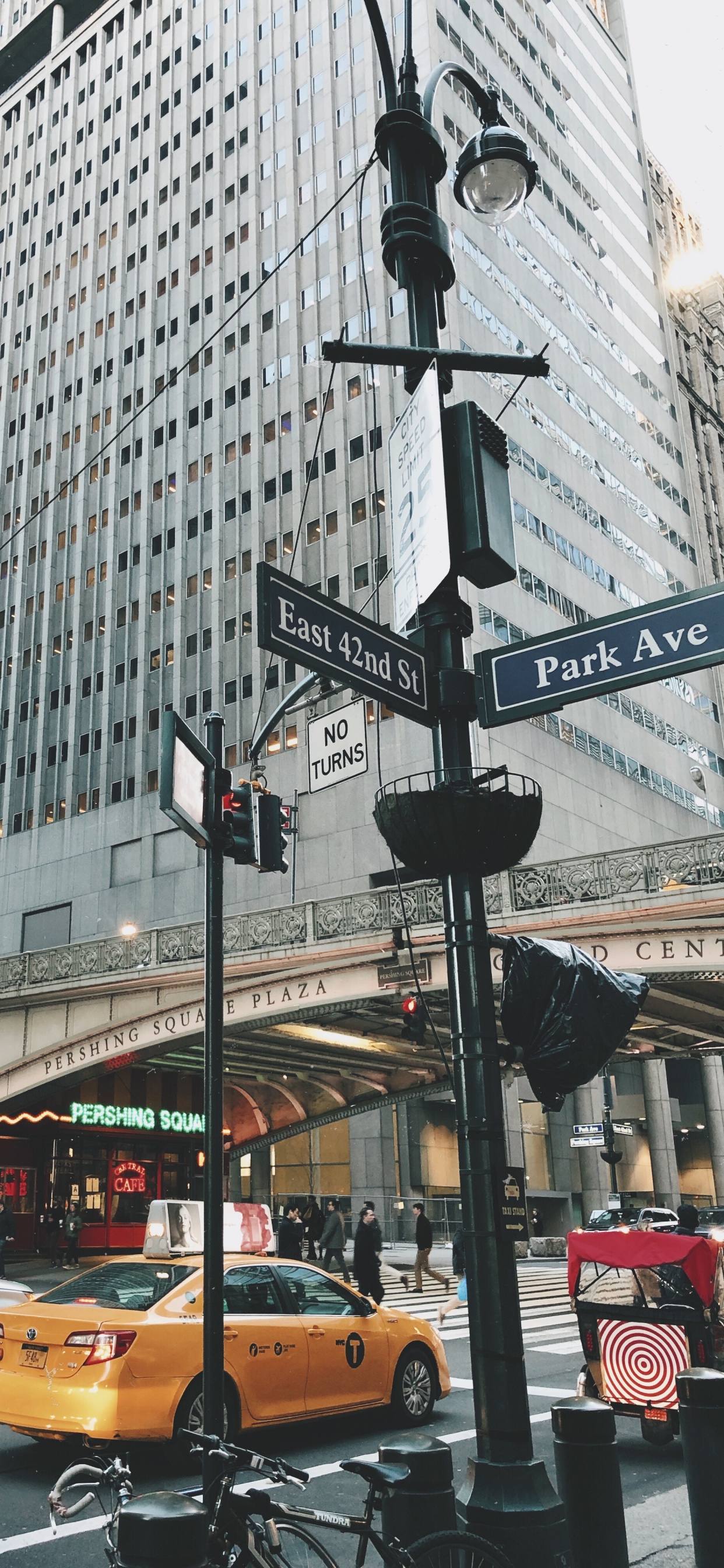 Cars on Road Near High Rise Buildings During Daytime. Wallpaper in 1242x2688 Resolution