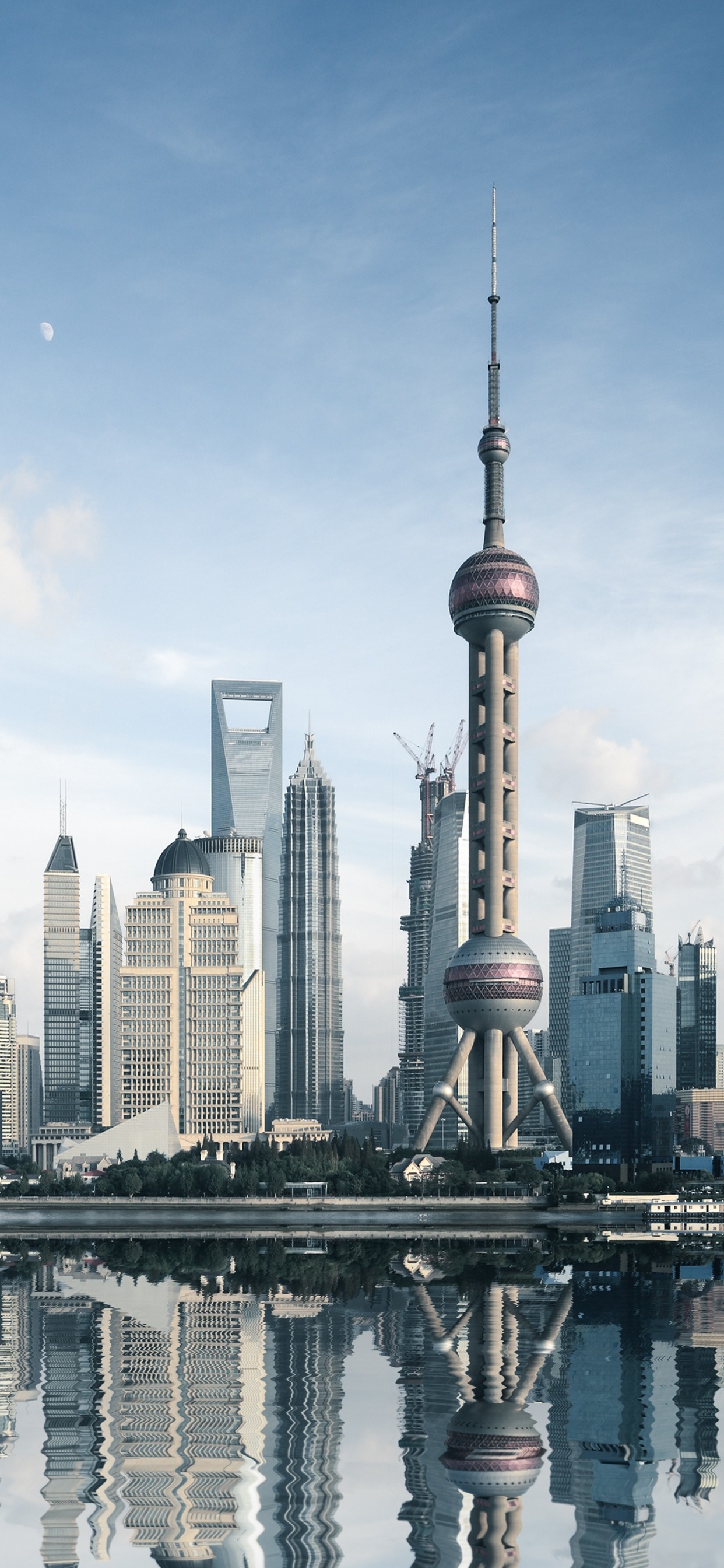 City Skyline Under Blue Sky During Daytime. Wallpaper in 1242x2688 Resolution