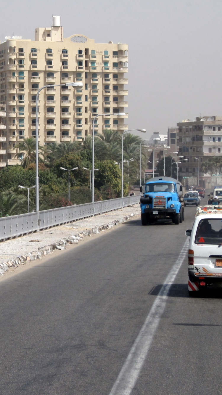 White Car on Road During Daytime. Wallpaper in 750x1334 Resolution