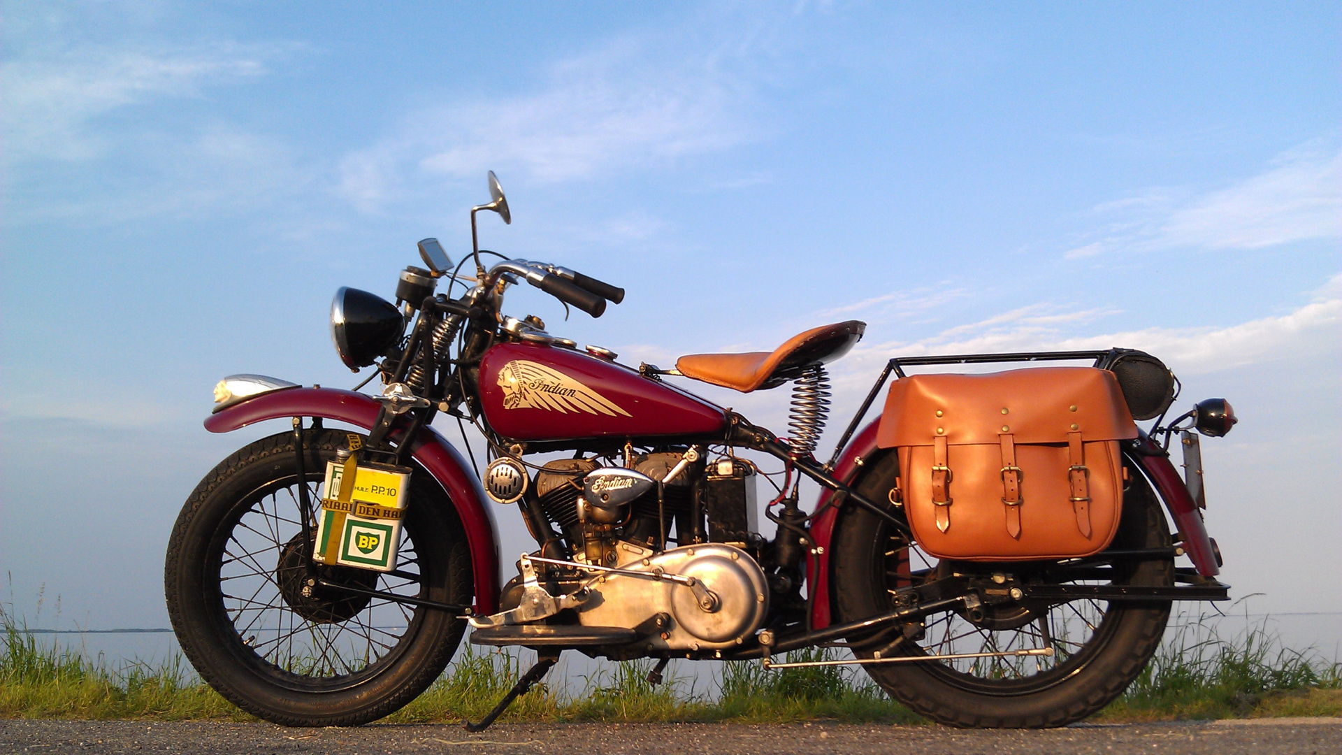 Orange and Black Motorcycle on Green Grass Field Under Blue Sky During Daytime. Wallpaper in 1920x1080 Resolution