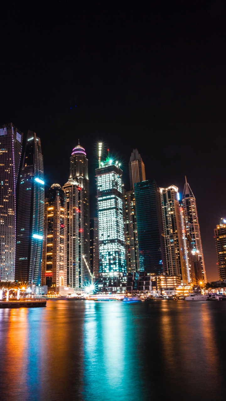 City Skyline During Night Time. Wallpaper in 720x1280 Resolution
