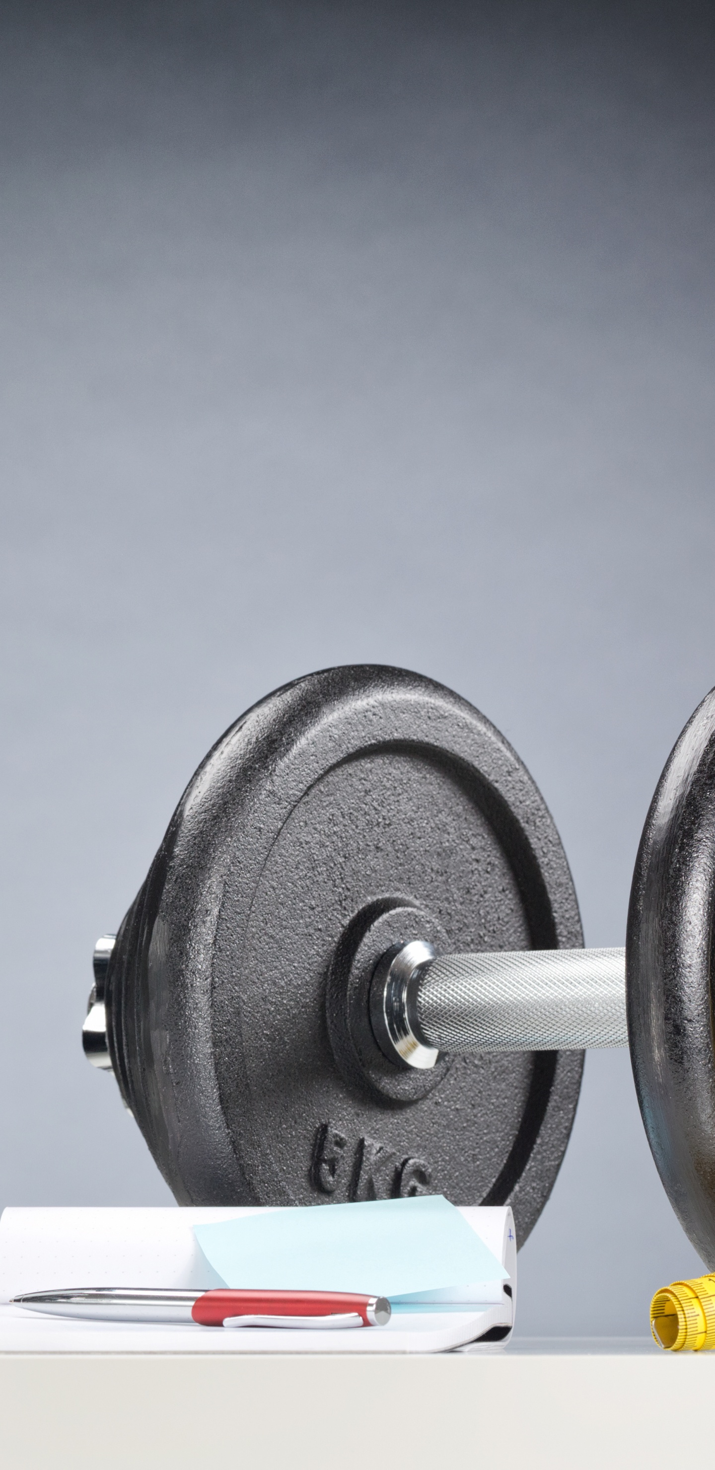 Black and White Dumbbells on White Table. Wallpaper in 1440x2960 Resolution