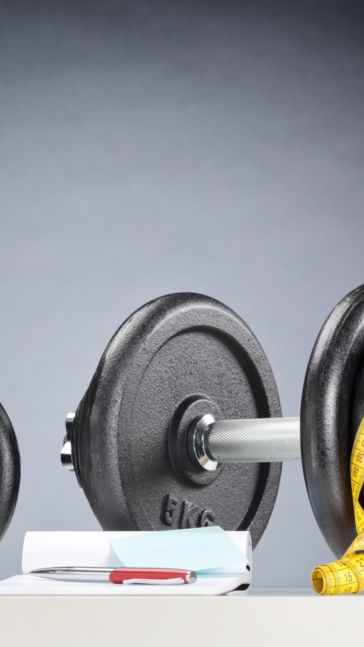 Black and White Dumbbells on White Table. Wallpaper in 720x1280 Resolution