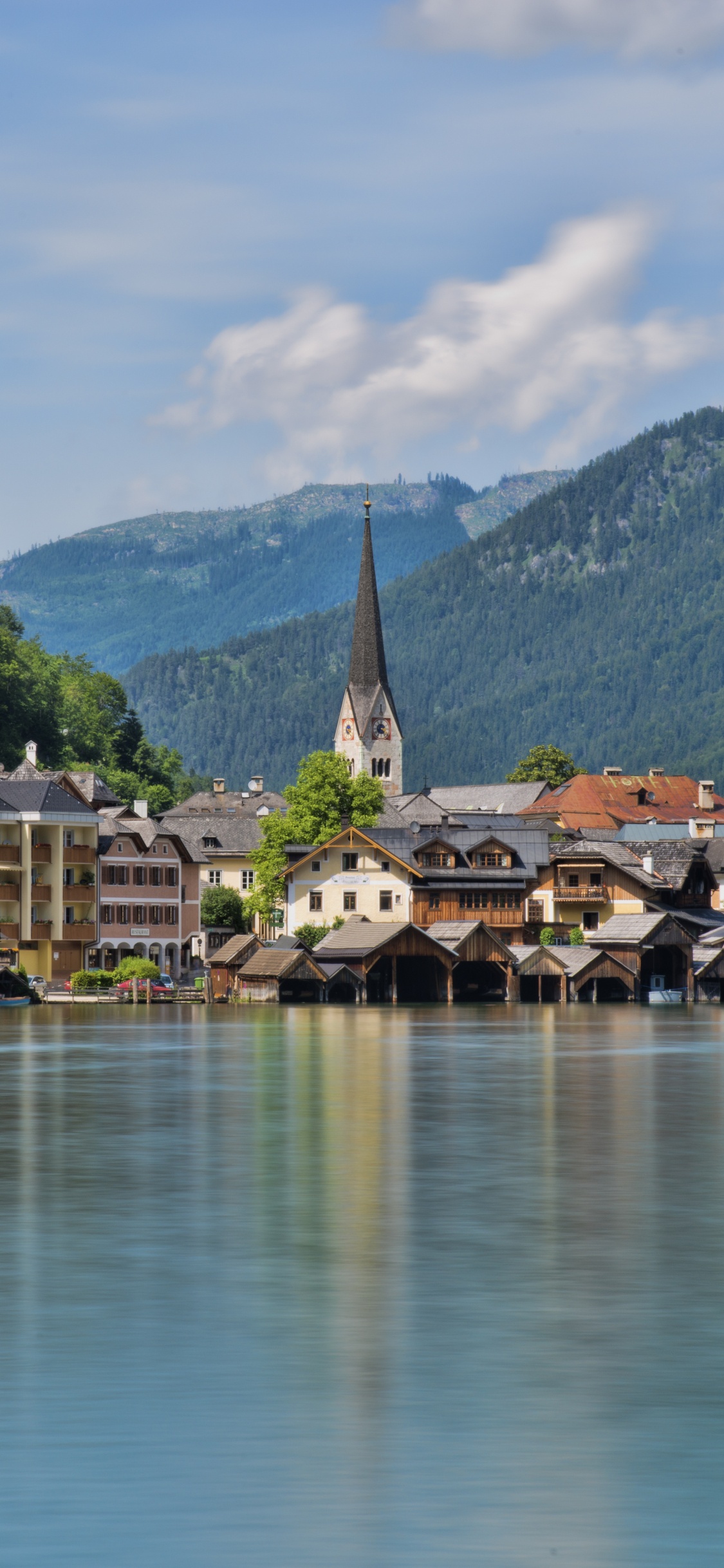 Houses Near Lake and Mountain During Daytime. Wallpaper in 1125x2436 Resolution