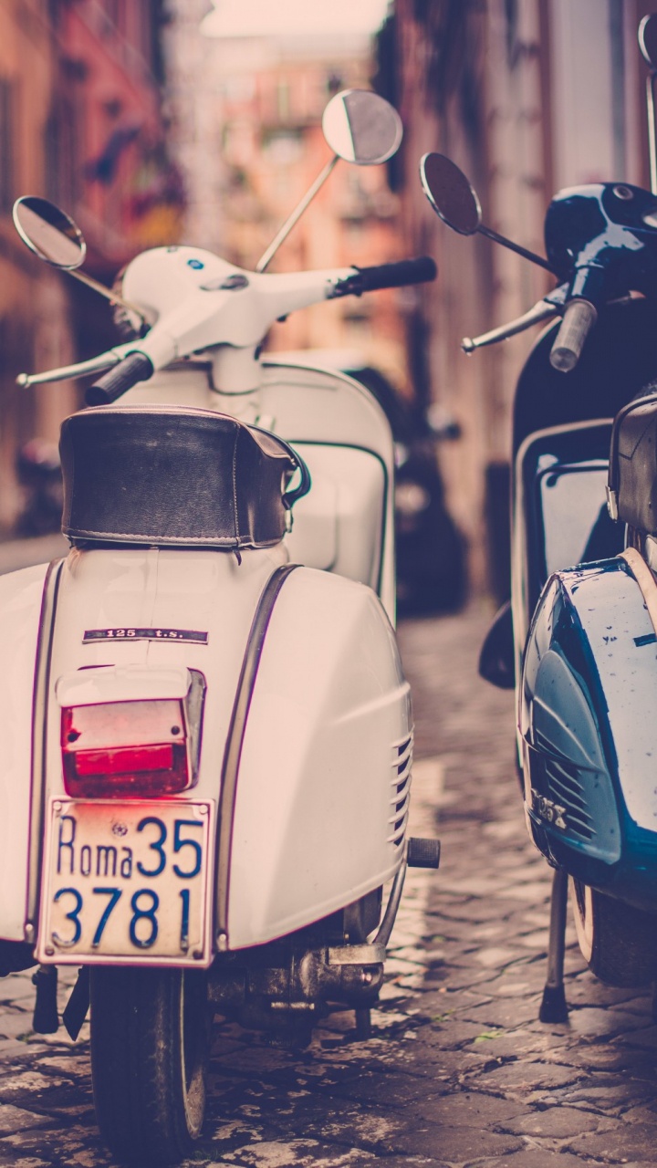 White and Black Motor Scooter Parked on Sidewalk During Daytime. Wallpaper in 720x1280 Resolution