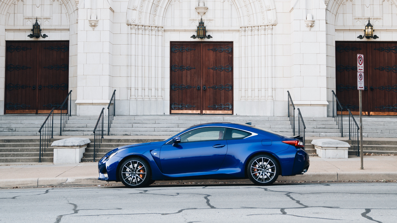 Blue Coupe Parked Beside White Concrete Building During Daytime. Wallpaper in 1280x720 Resolution