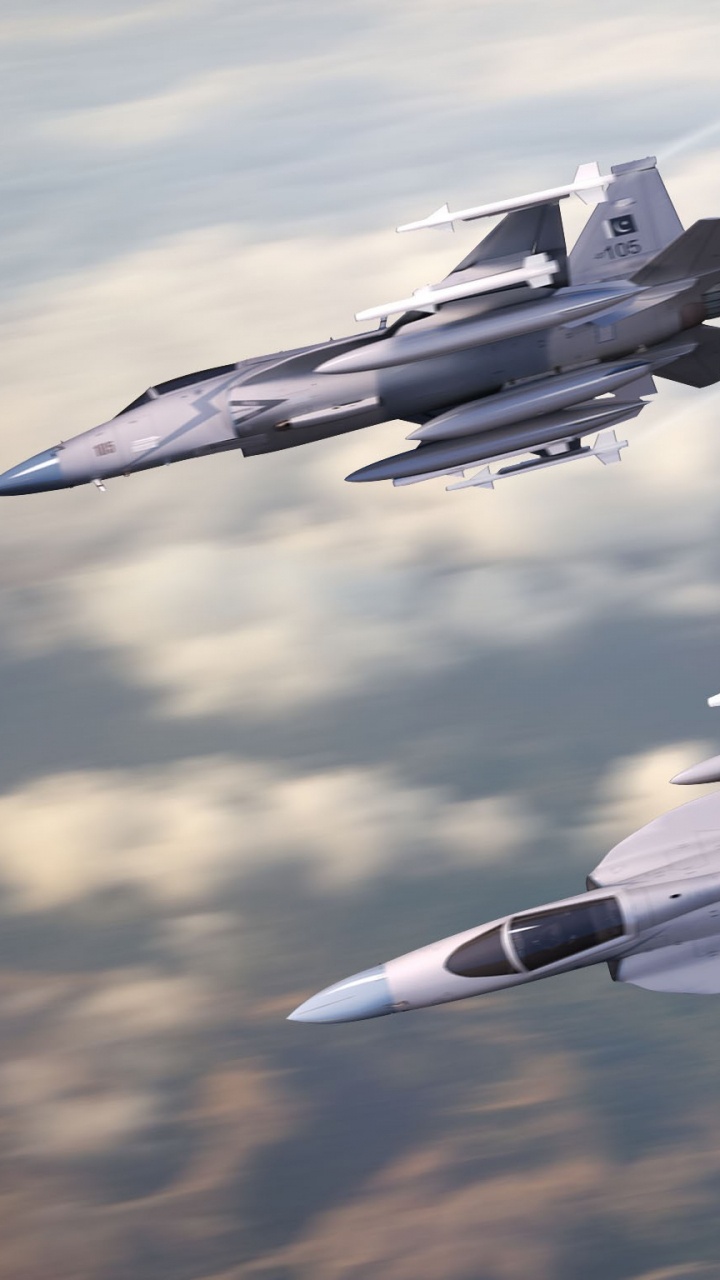 Gray Fighter Plane in Mid Air. Wallpaper in 720x1280 Resolution