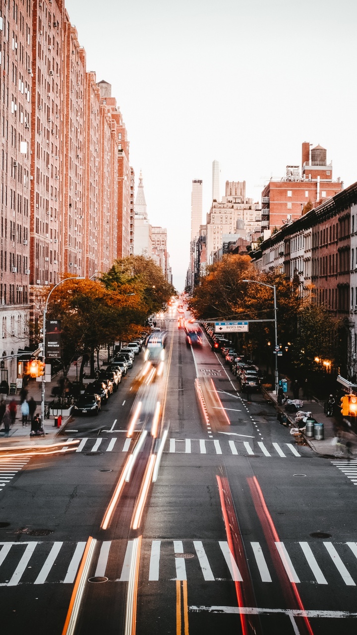 Cars on Road Between High Rise Buildings During Daytime. Wallpaper in 720x1280 Resolution