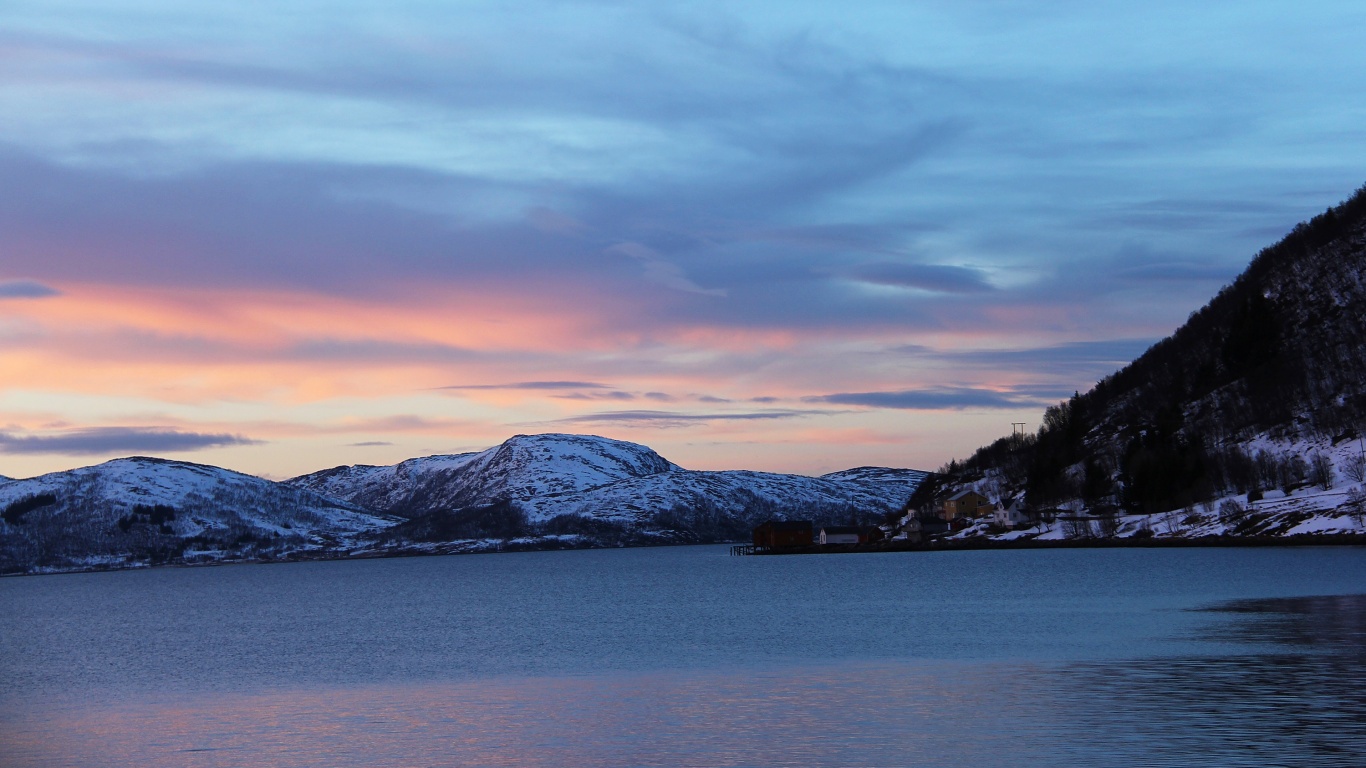 Snow Covered Mountain Near Body of Water During Daytime. Wallpaper in 1366x768 Resolution