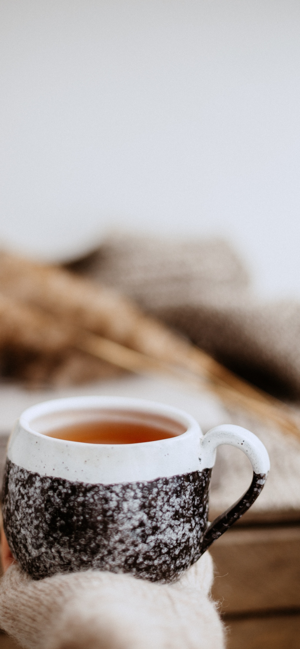 White and Black Ceramic Mug With Brown Liquid. Wallpaper in 1242x2688 Resolution