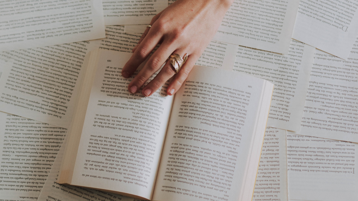 Person Holding White Ceramic Mug on White Book Page. Wallpaper in 1366x768 Resolution