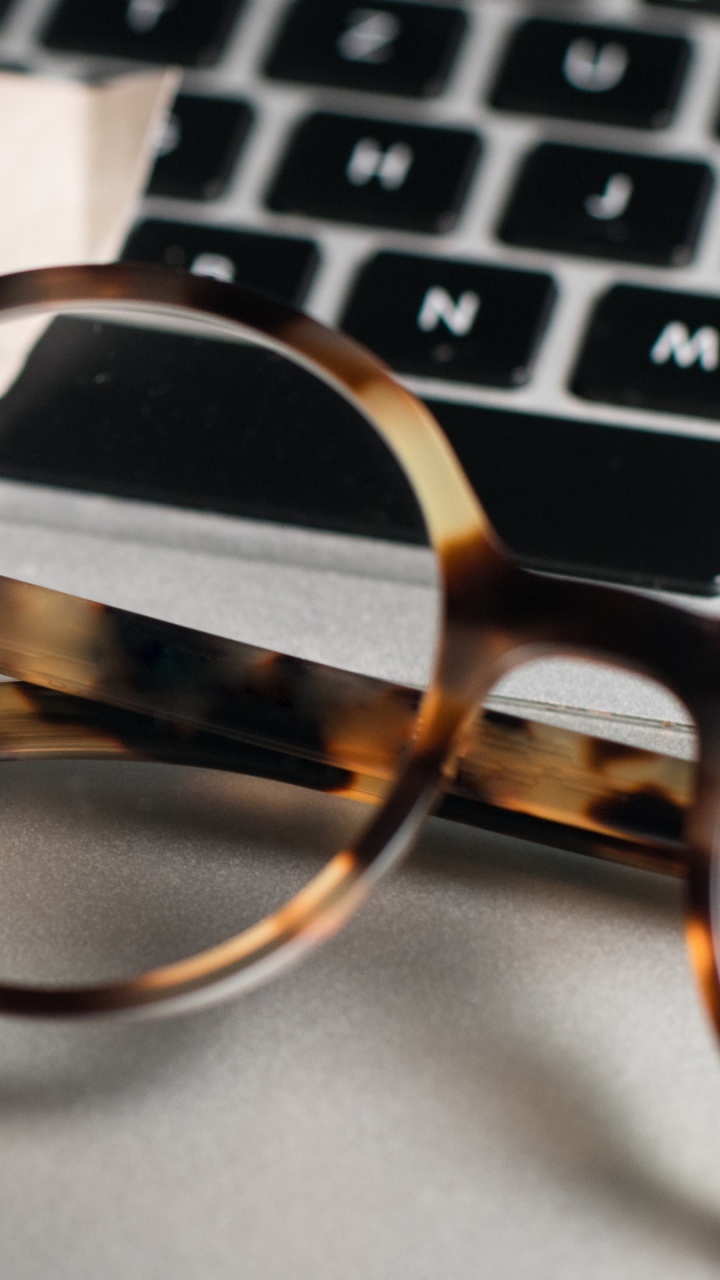 Brown and Black Framed Eyeglasses on White Printer Paper. Wallpaper in 720x1280 Resolution