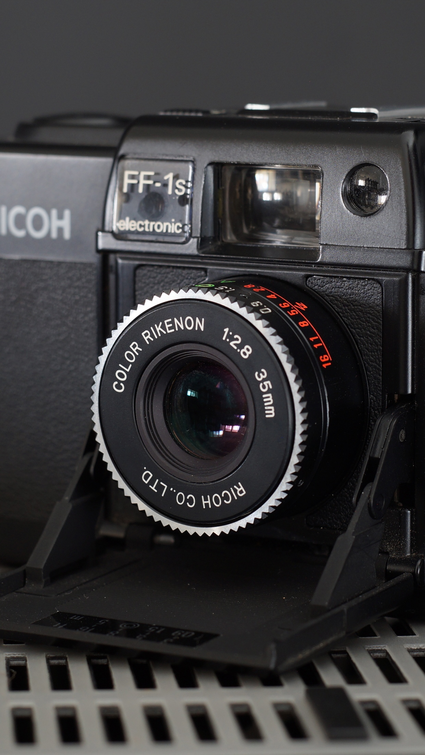 Black Nikon Dslr Camera on Black Metal Frame. Wallpaper in 1440x2560 Resolution