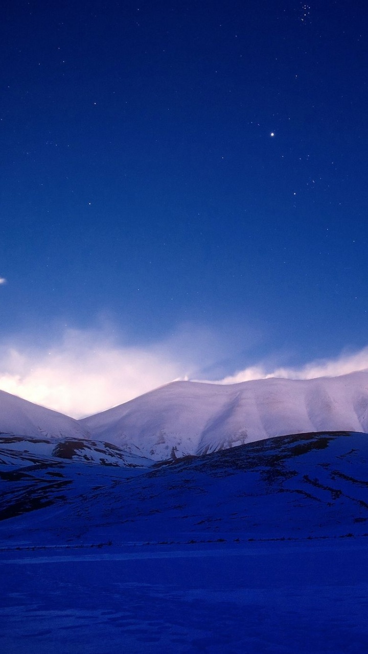 Snow Covered Mountain Under Blue Sky During Daytime. Wallpaper in 720x1280 Resolution