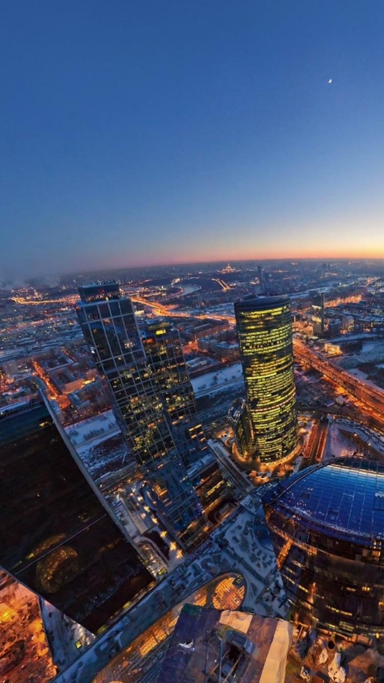 Aerial View of City Buildings During Night Time. Wallpaper in 750x1334 Resolution