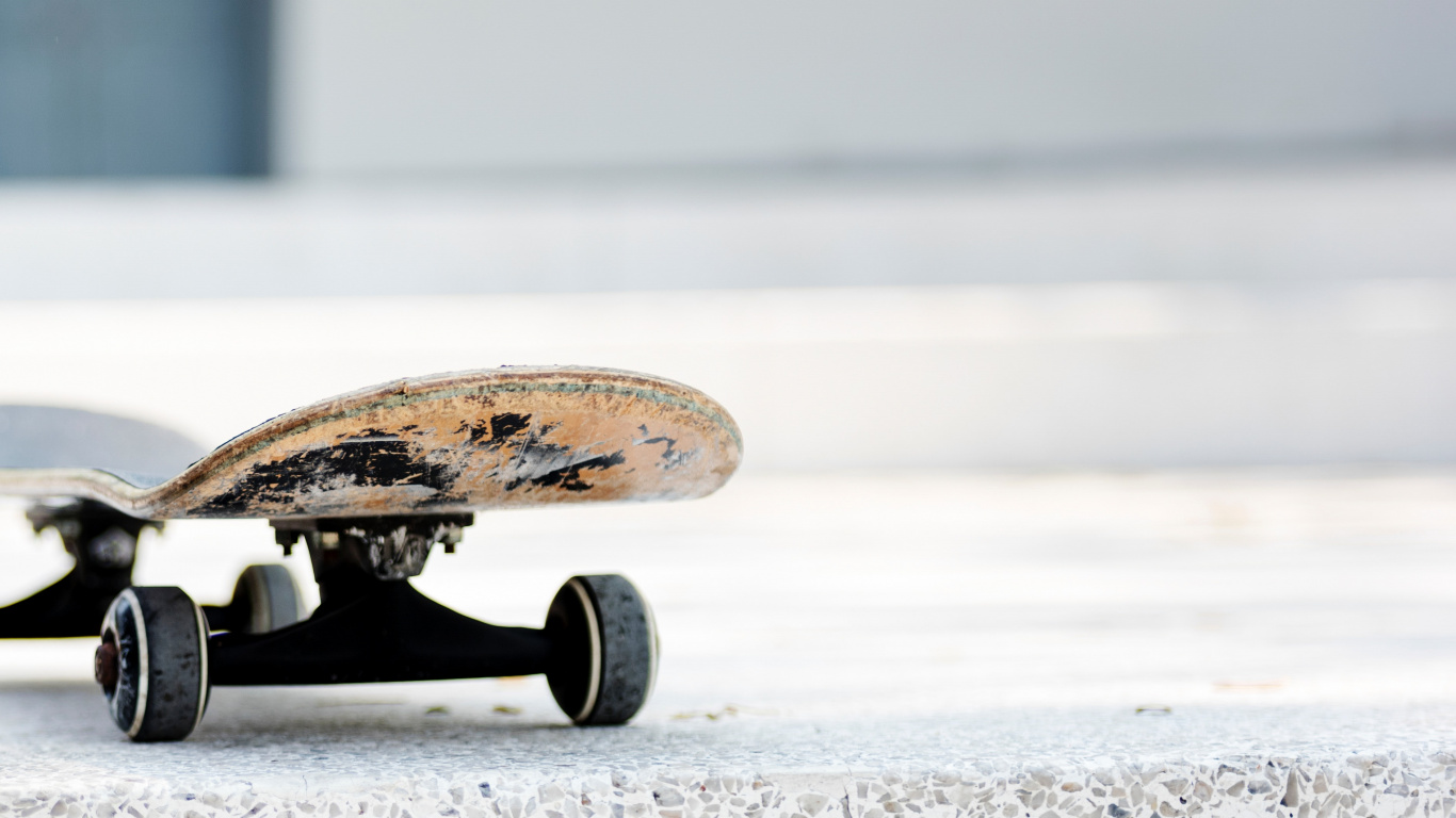 Brown and Black Skateboard on Gray Concrete Floor. Wallpaper in 1366x768 Resolution