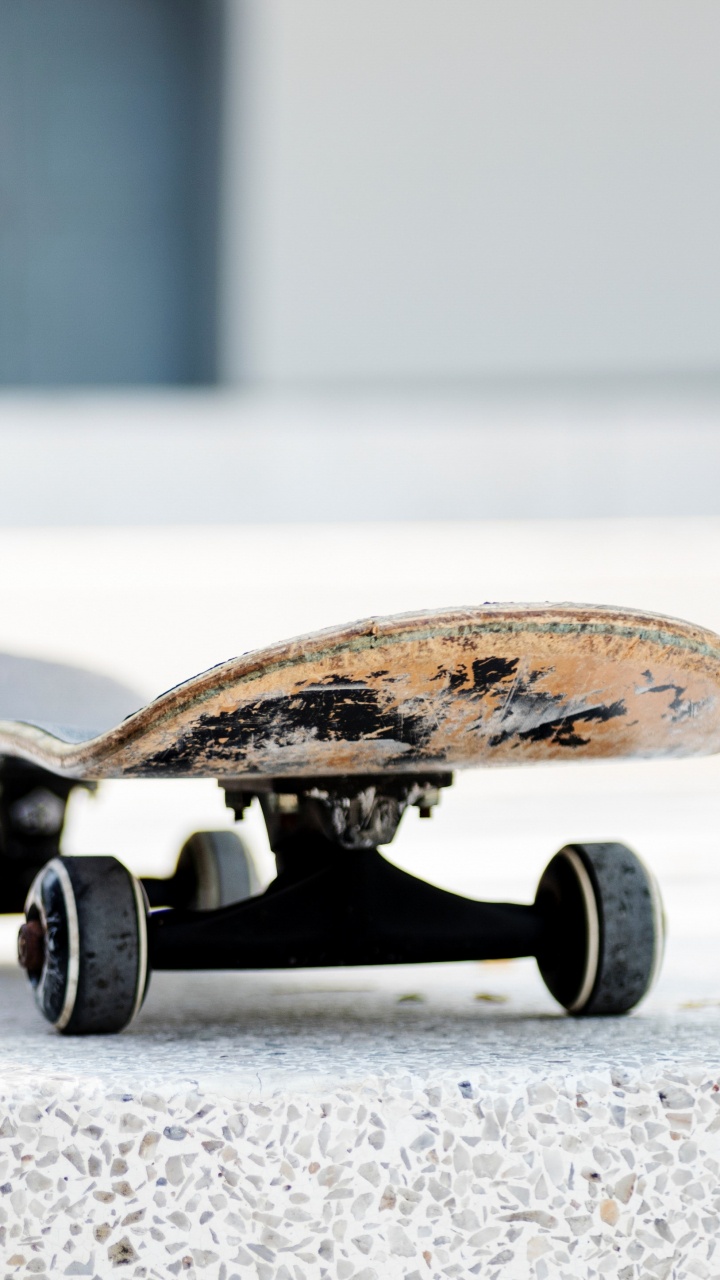 Brown and Black Skateboard on Gray Concrete Floor. Wallpaper in 720x1280 Resolution