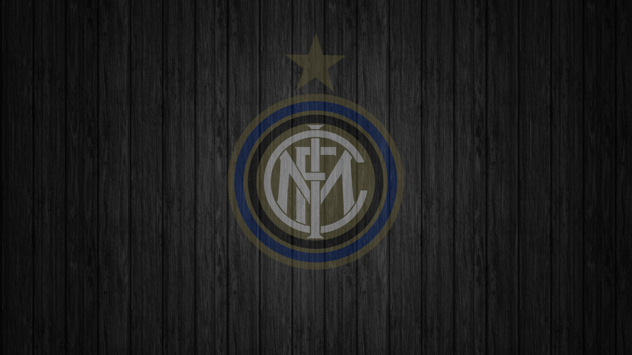 Blue and Yellow Logo on Brown Wooden Surface. Wallpaper in 1280x720 Resolution