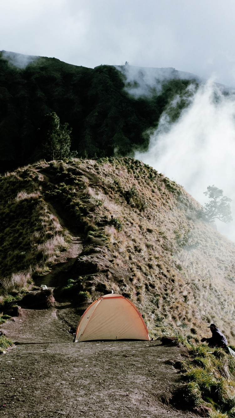 Orange Dome Tent on Brown and Green Mountain. Wallpaper in 750x1334 Resolution