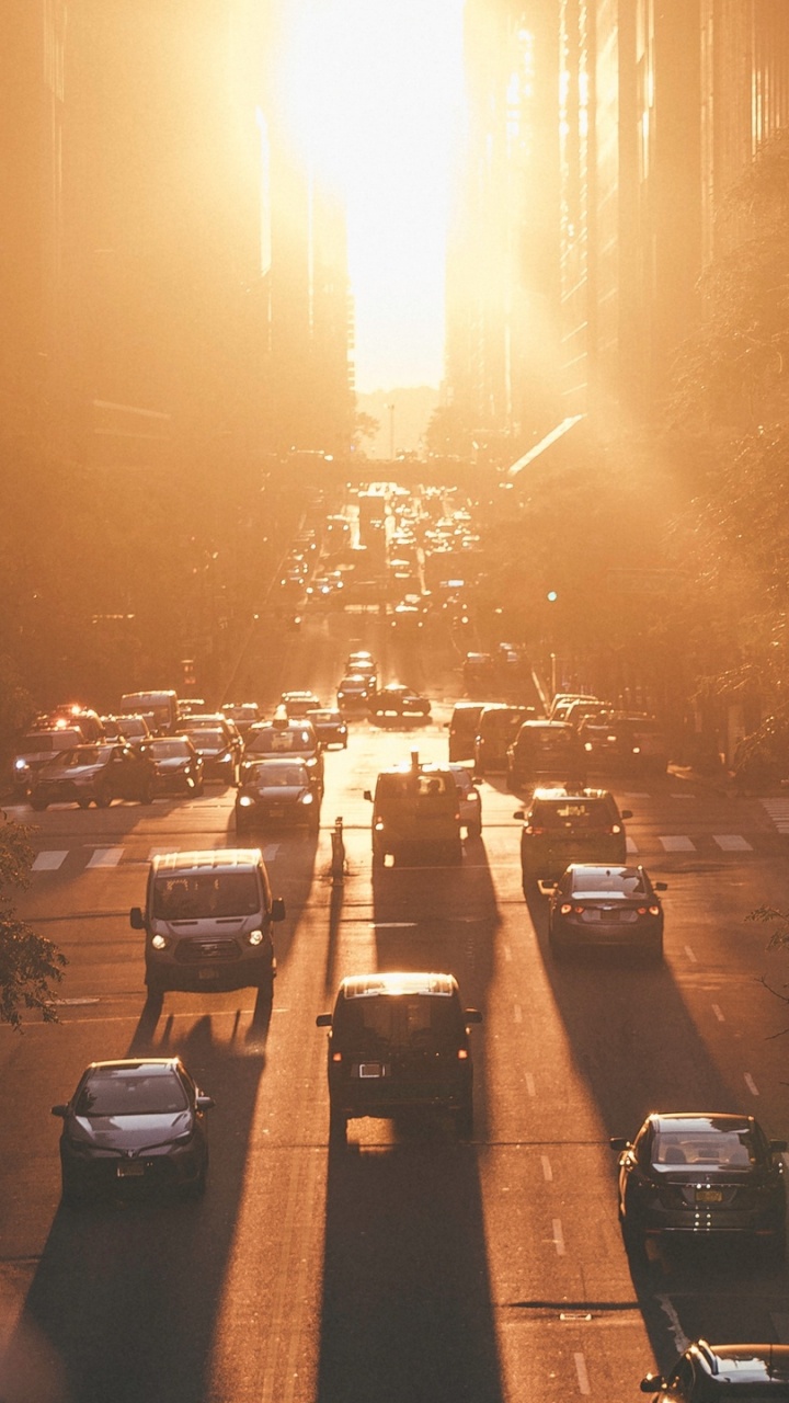 Cars Parked on Parking Lot During Sunset. Wallpaper in 720x1280 Resolution