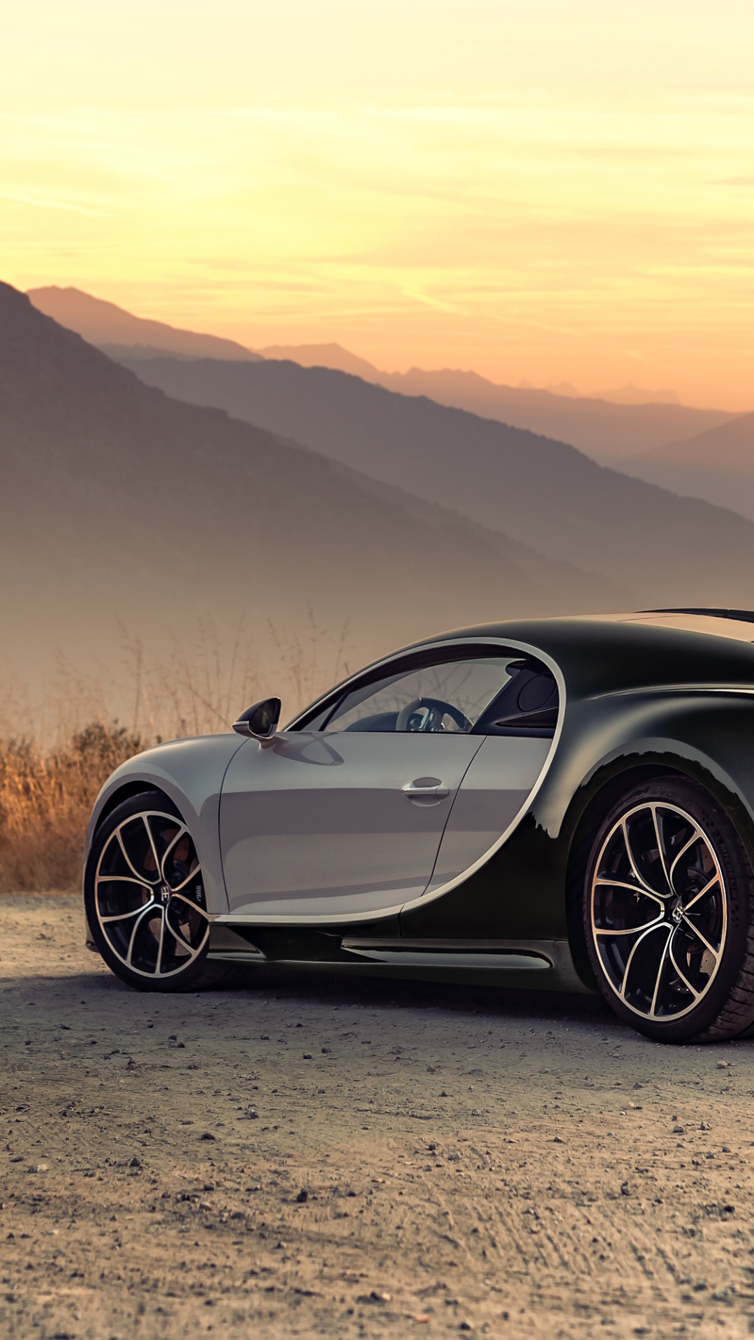 Black and Red Ferrari Sports Car on Brown Field During Daytime. Wallpaper in 1080x1920 Resolution