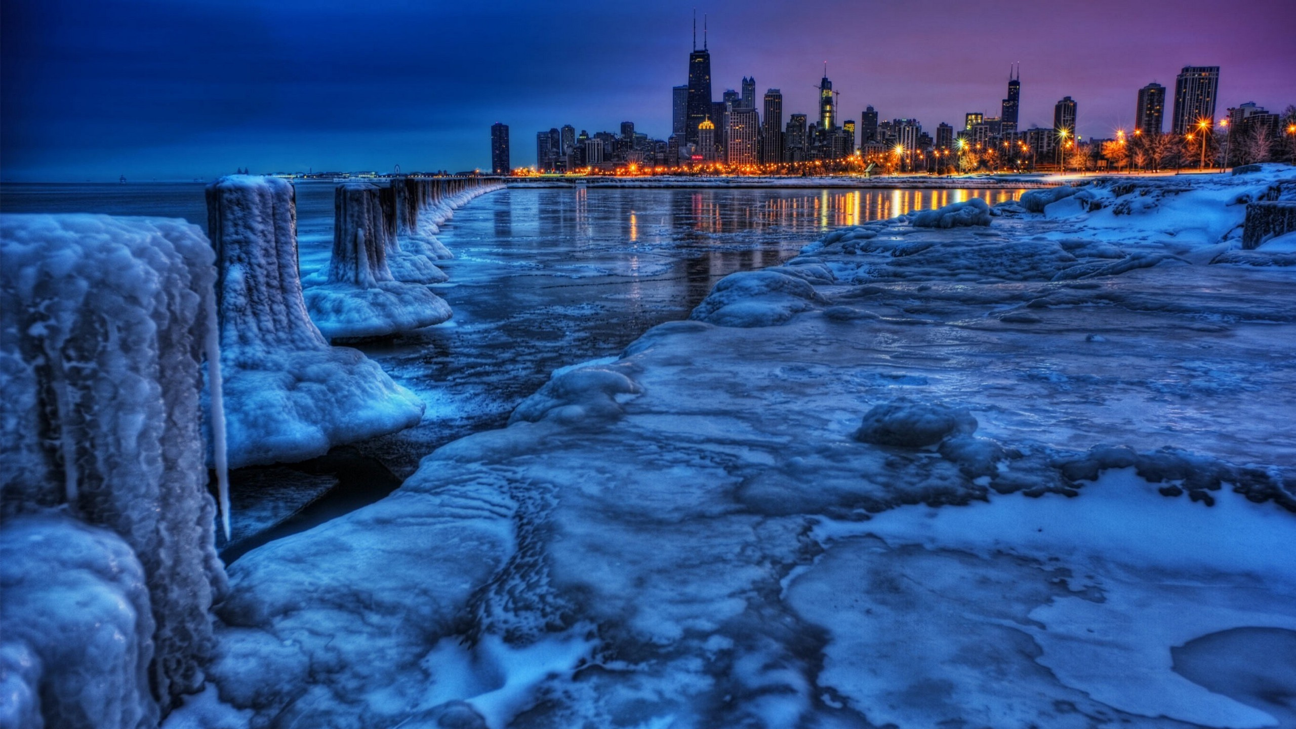 Body of Water Near Bridge During Night Time. Wallpaper in 2560x1440 Resolution