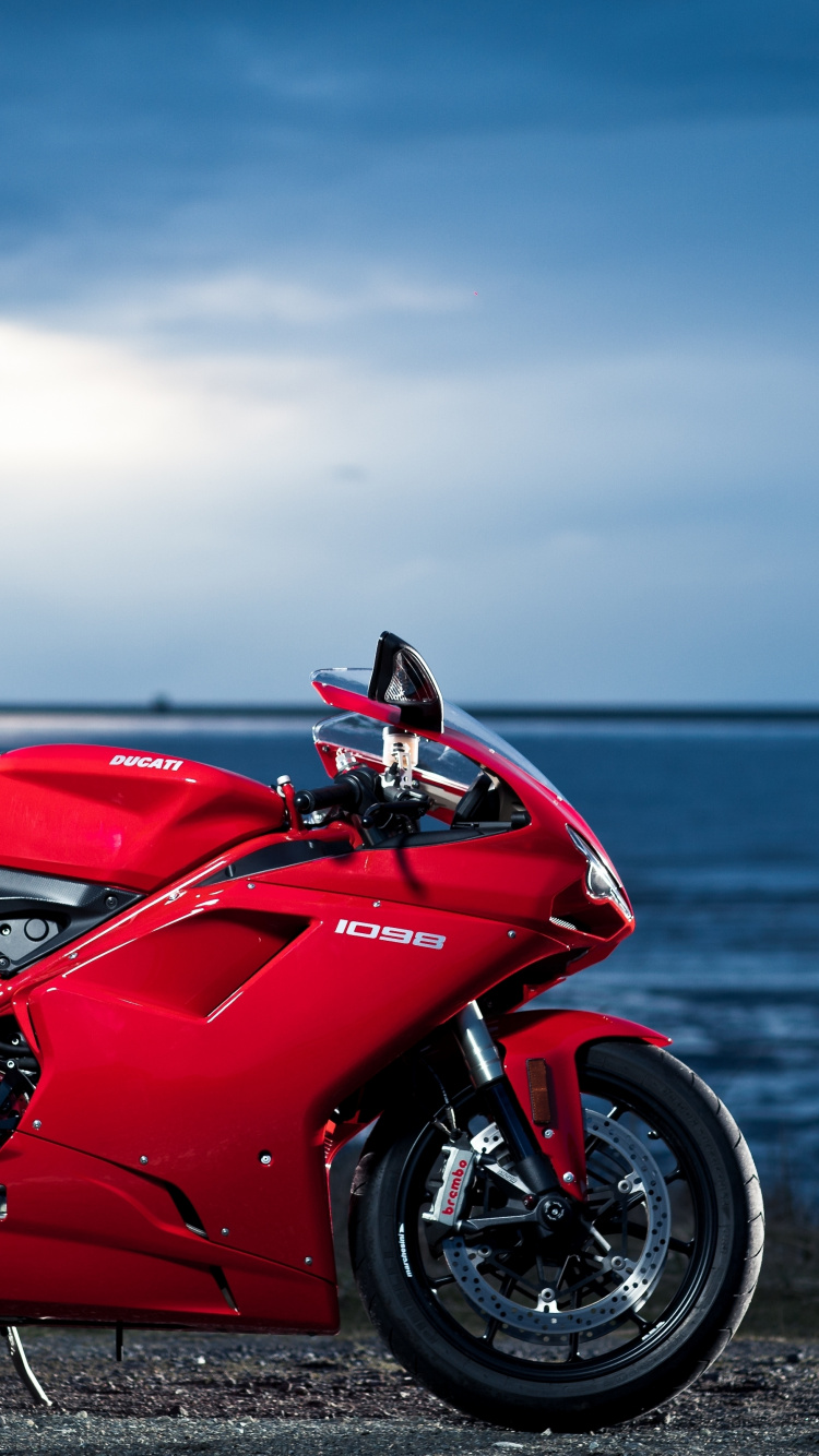 Red and Black Sports Bike on Seashore During Daytime. Wallpaper in 750x1334 Resolution