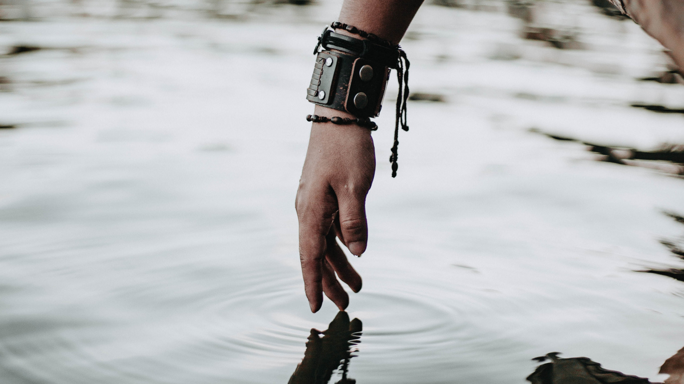 Person Wearing Black Leather Strap Watch and Black Leather Strap Watch. Wallpaper in 1366x768 Resolution