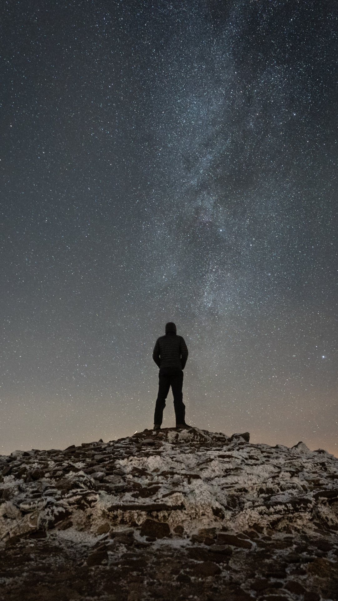 Download 1080x1920 Wallpaper Silhouette of Man Standing on Rocky Hill Under Starry Night Silhouette of Man Standing on Rocky Hill Under Starry Night. Wallpaper in 1080x1920 Resolution