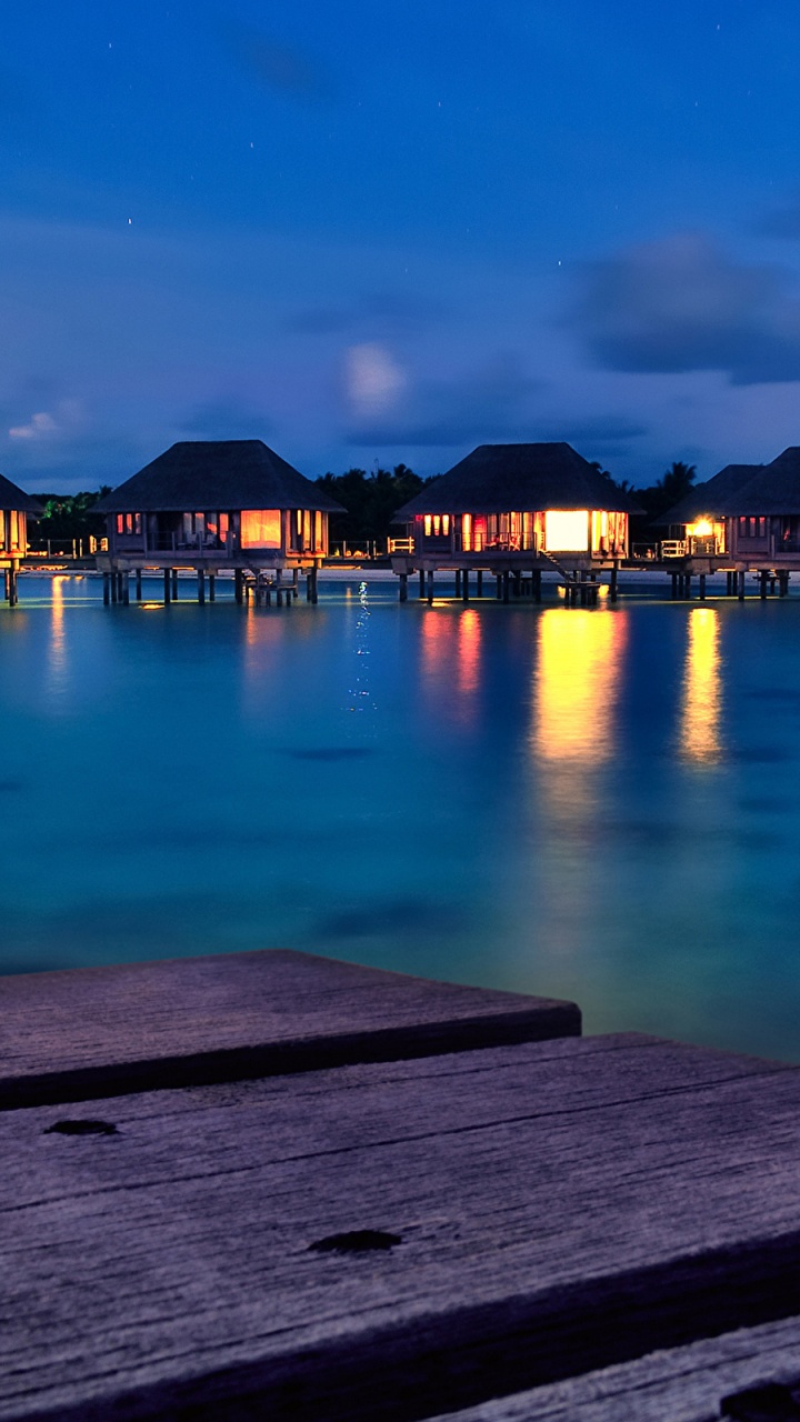Brown Wooden Dock on Body of Water During Night Time. Wallpaper in 720x1280 Resolution