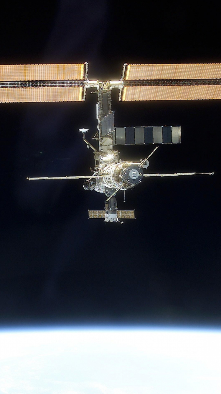 Avion Noir et Blanc Sur Surface Noire. Wallpaper in 750x1334 Resolution