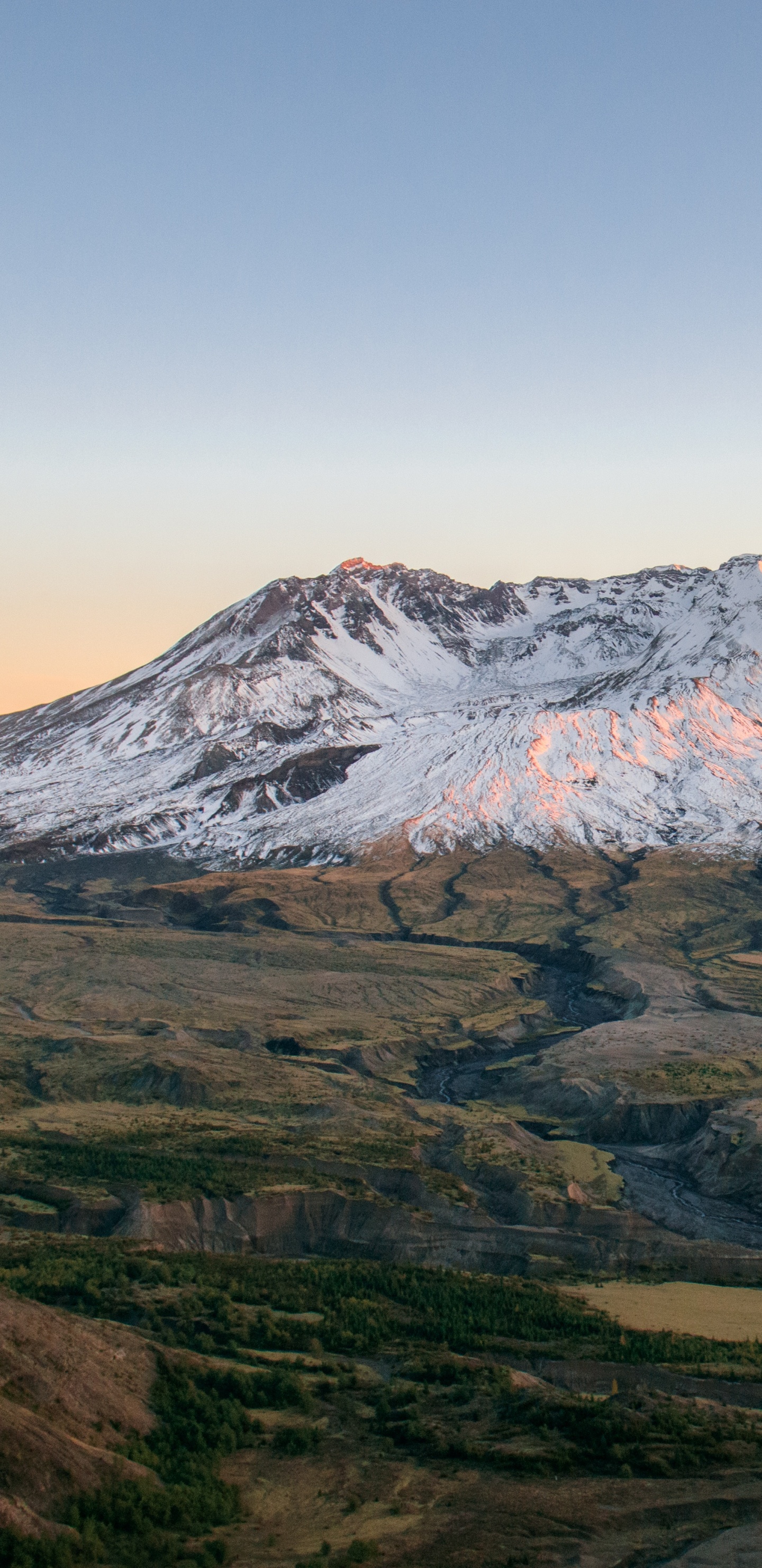 Brown and White Mountain Under Blue Sky During Daytime. Wallpaper in 1440x2960 Resolution