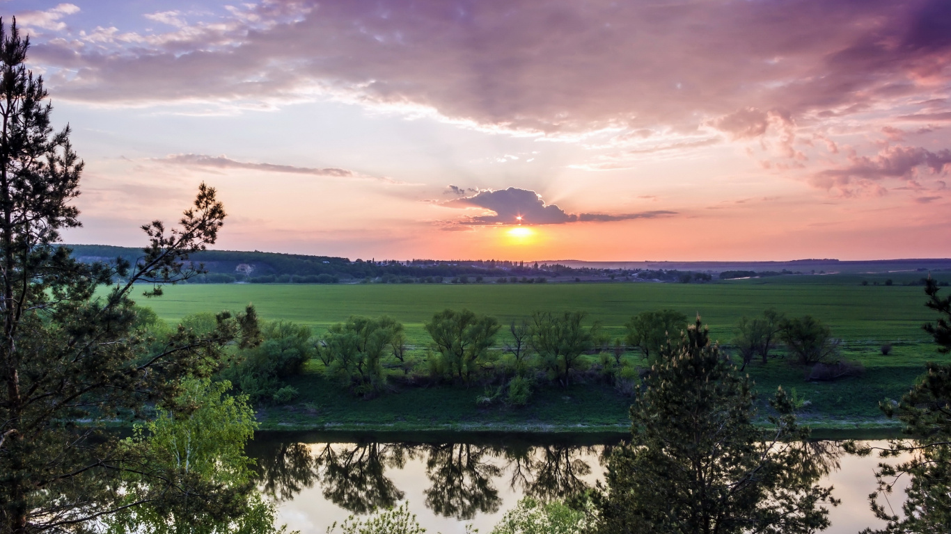 Green Trees Near Body of Water During Sunset. Wallpaper in 1366x768 Resolution