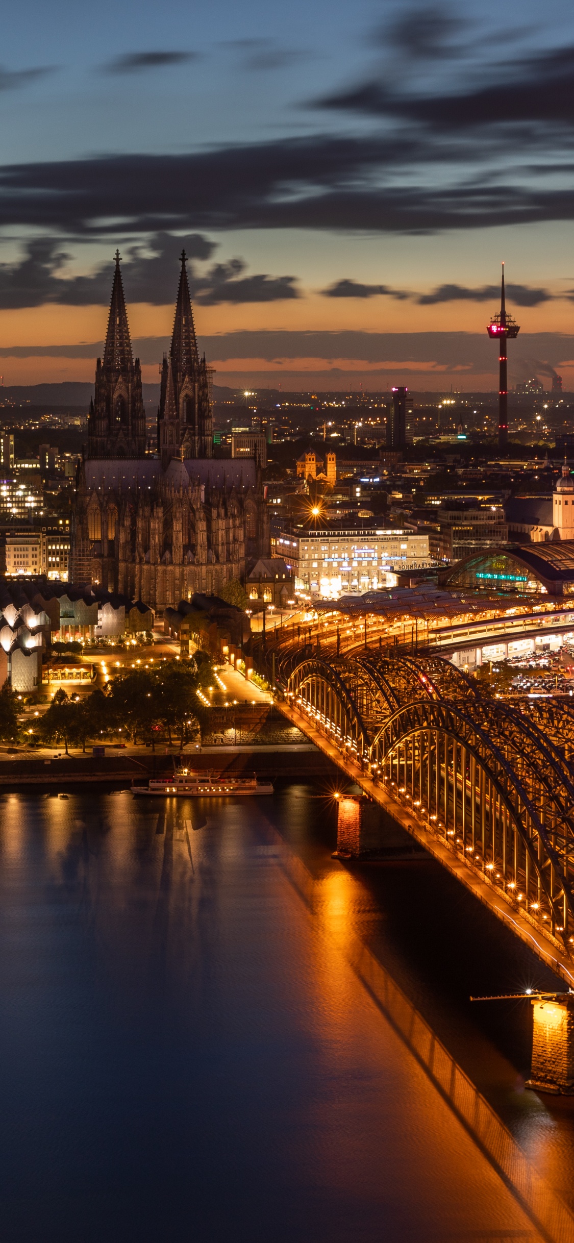 City Skyline During Night Time. Wallpaper in 1125x2436 Resolution