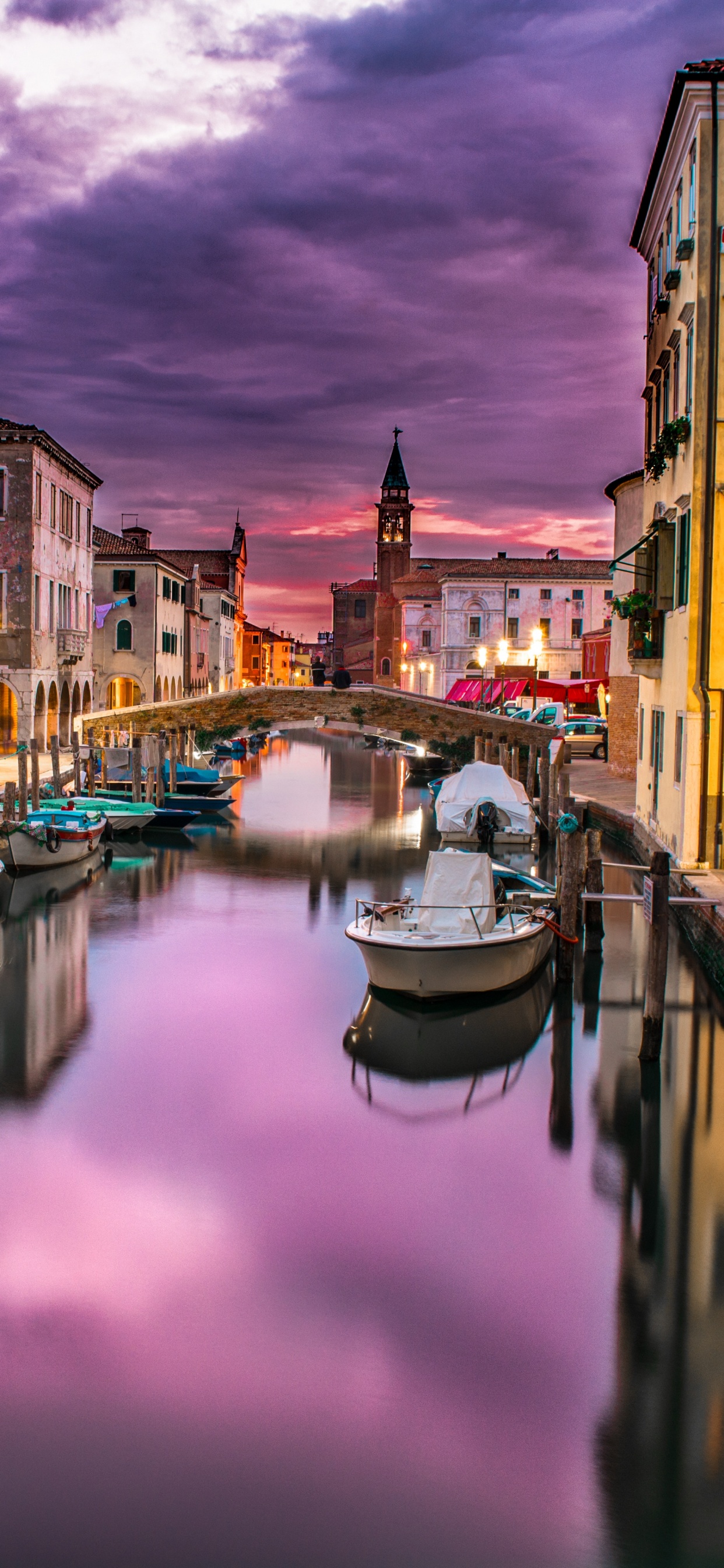 Boat on River Between Buildings During Daytime. Wallpaper in 1242x2688 Resolution