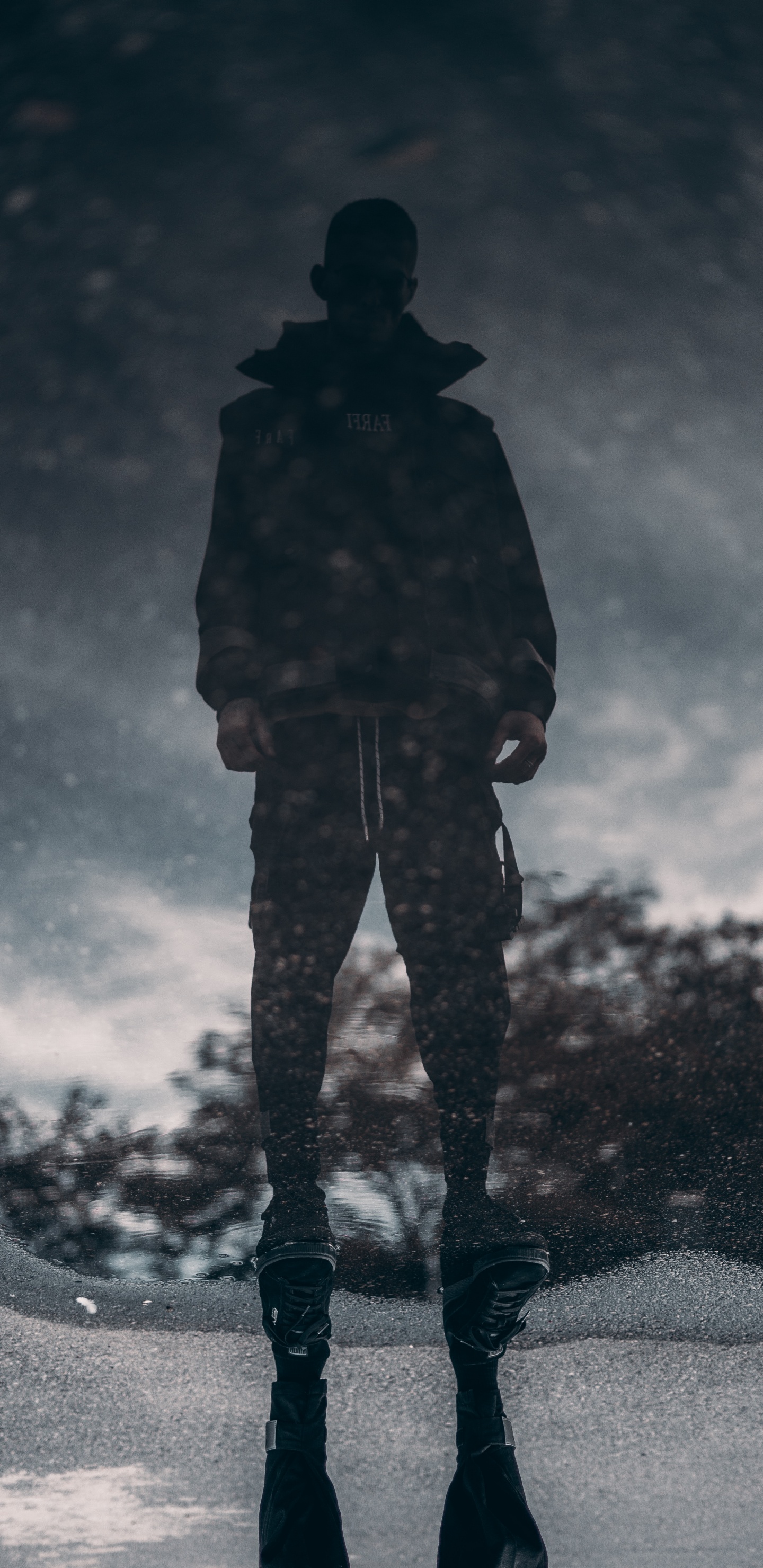 Man in Black Jacket and Pants Standing on Black and White Sky. Wallpaper in 1440x2960 Resolution