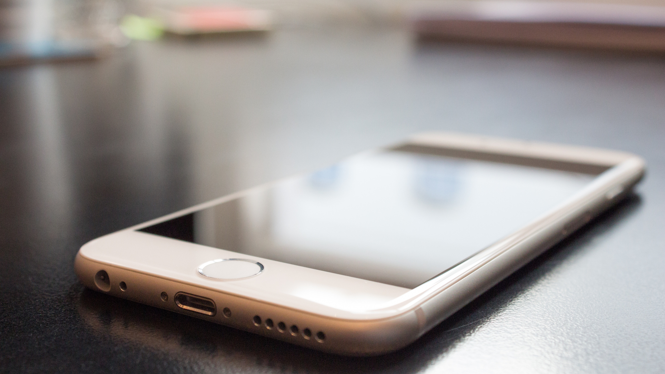 Gold Iphone 6 on Table. Wallpaper in 2560x1440 Resolution