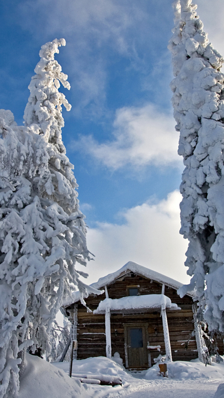 Brown Wooden House Covered With Snow Under Blue Sky During Daytime. Wallpaper in 750x1334 Resolution