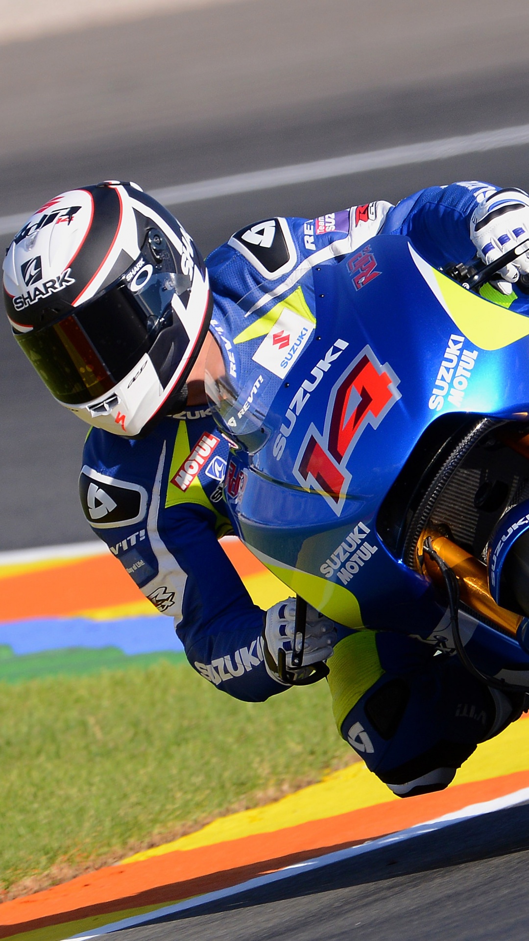Man in Red and White Racing Suit Riding on Blue and Red Sports Bike. Wallpaper in 1080x1920 Resolution