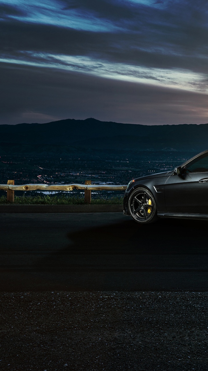 Black Sedan on Gray Asphalt Road During Daytime. Wallpaper in 720x1280 Resolution