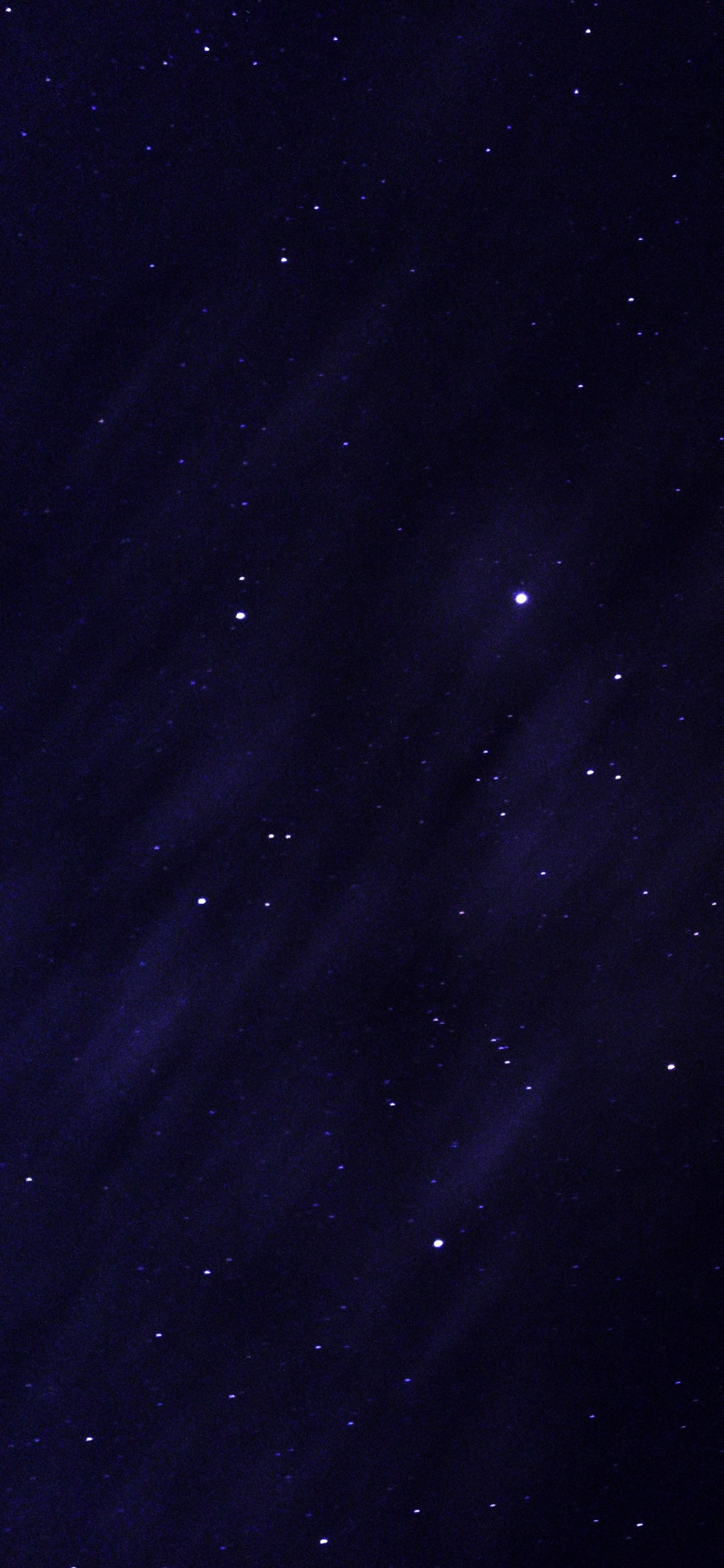 Starry Night Sky Over The Starry Night. Wallpaper in 1125x2436 Resolution